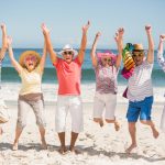 Happy Group on Beach dreamstime_m_68295940